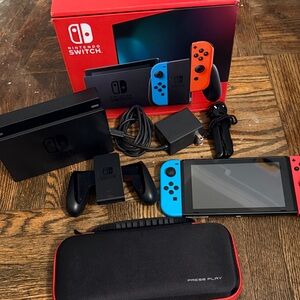 Nintendo Switch Console with Blue and Red Controllers